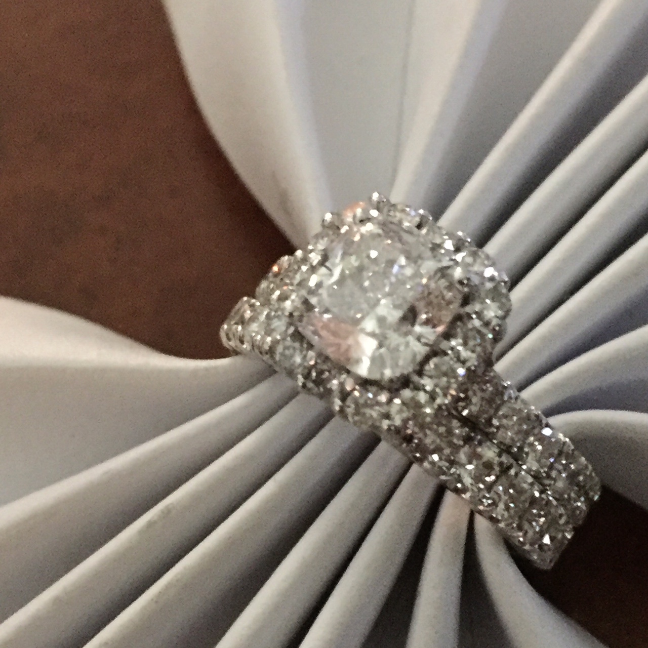 Halo style diamond engagement ring on white gold